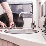 inspecting the plumbing on a motorhome